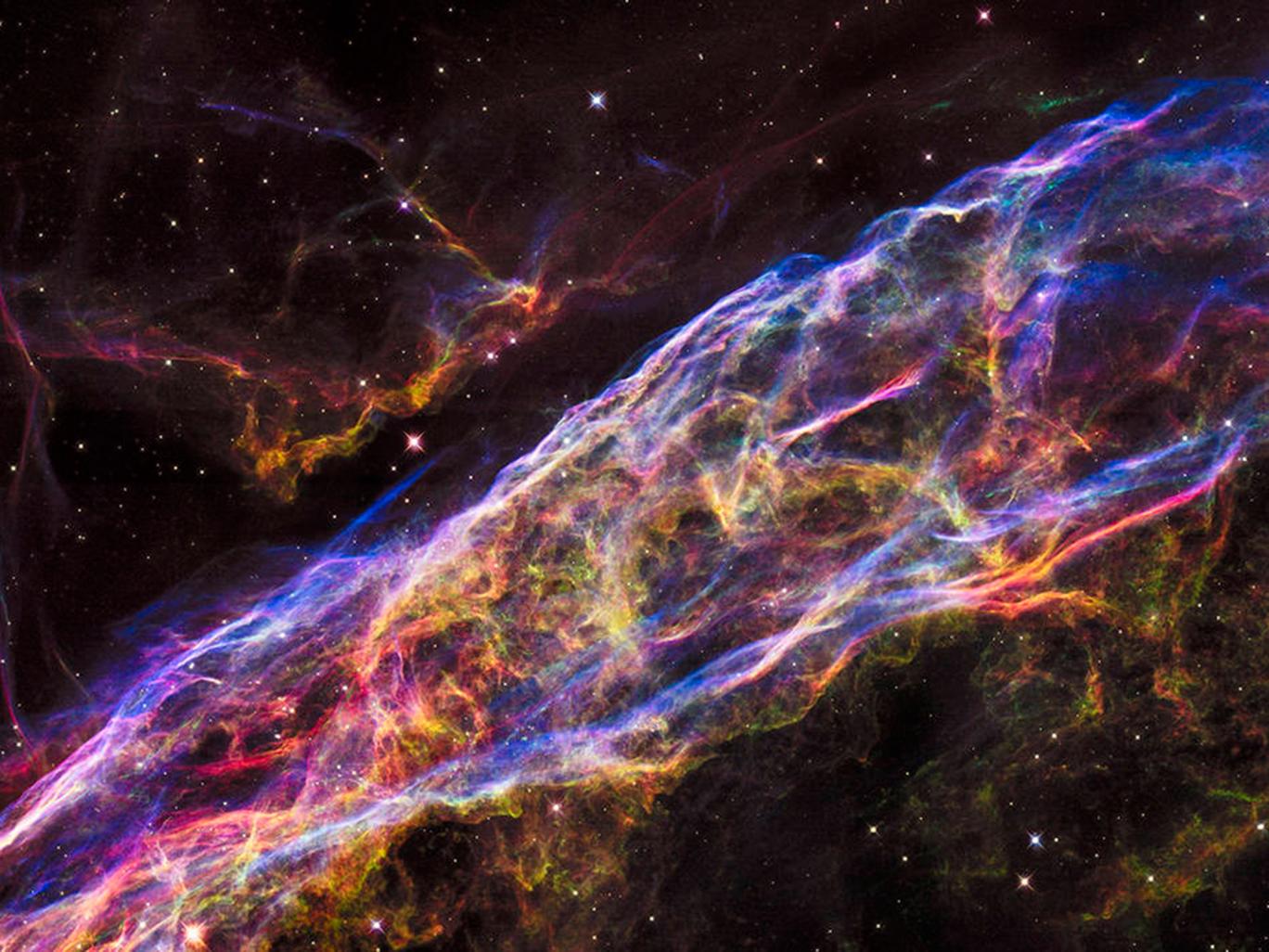 Nasa's Hubble Space Telescope has unveiled in stunning detail a small section of the Veil Nebula - expanding remains of a massive star that exploded about 8,000 years ago. Nasa's Hubble Space Telescope has unveiled in stunning detail a small section of the Veil Nebula - expanding remains of a massive star that exploded about 8,000 years ago.