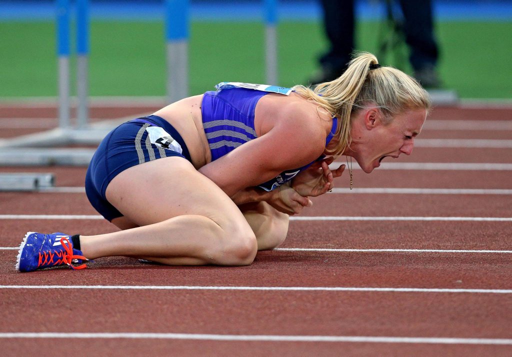 Sally Pearson shouts in pain after hitting an obstacle during the women's 100 hurdles event, at the Golden Gala IAAF athletic meeting, in Rome's Olympic stadium, Thursday, June 4, 2015. Olympic champion Sally Pearson of Australia was injured after hitting the fifth obstacle in the 100 hurdles. She was carried off on a stretcher after getting attention to her left wrist area. (Alessandro Di Meo/ANSA via AP) Sally Pearson shouts in pain after hitting an obstacle during the women's 100 hurdles event, at the Golden Gala IAAF athletic meeting, in Rome's Olympic stadium, Thursday, June 4, 2015. Olympic champion Sally Pearson of Australia was injured after hitting the fifth obstacle in the 100 hurdles. She was carried off on a stretcher after getting attention to her left wrist area. (Alessandro Di Meo/ANSA via AP)
