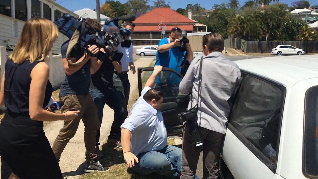 ON BAIL: Former Ipswich scout leader Brock Dittman is mobbed by reporters as he leaves Ipswich Magistrates Court. The 31-year-old has been accused of 129 child exploitation offences. ON BAIL: Former Ipswich scout leader Brock Dittman is mobbed by reporters as he leaves Ipswich Magistrates Court. The 31-year-old has been accused of 129 child exploitation offences.