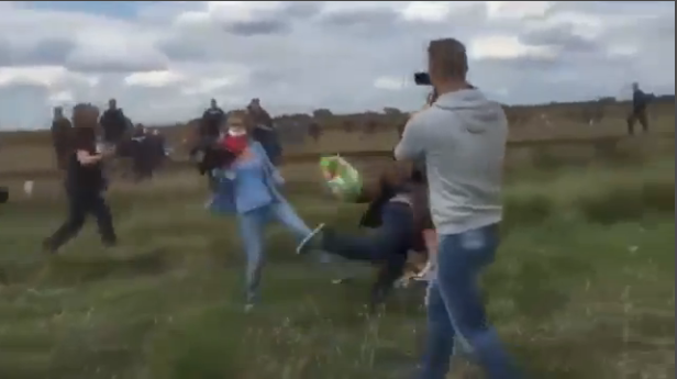 The moment a Hungarian camerawoman deliberately tripped a Syrian refugee. The moment a Hungarian camerawoman deliberately tripped a Syrian refugee.