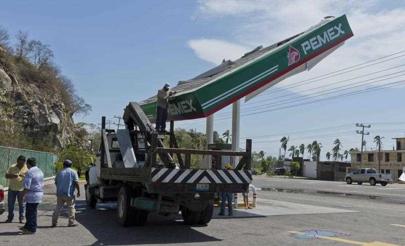 Employees of a PEMEX petrol station work to fix the roof of one of the pumps after the passage of hurricane Patricia in Melaque, Jalisco state, Mexico on October 24, 2015. Patricia flattened dozens of homes on Mexico's Pacific coast, but authorities said Saturday the record-breaking hurricane largely spared the country as it weakened to a tropical depression. Employees of a PEMEX petrol station work to fix the roof of one of the pumps after the passage of hurricane Patricia in Melaque, Jalisco state, Mexico on October 24, 2015. Patricia flattened dozens of homes on Mexico's Pacific coast, but authorities said Saturday the record-breaking hurricane largely spared the country as it weakened to a tropical depression.