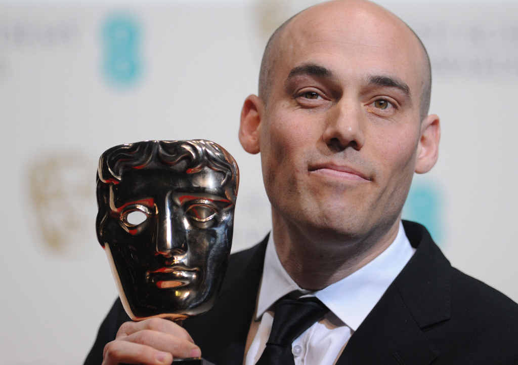 REWARD: US director Joshua Oppenheimer poses with the award for documentary The Act Of Killing at the British Academy Film Awards.