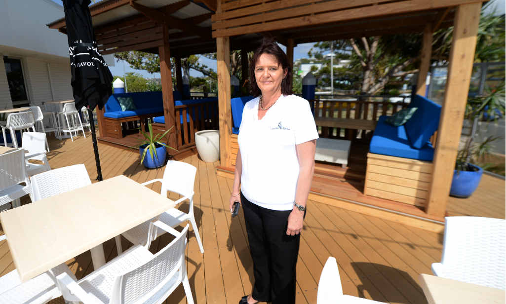 FRESH LOOK: Keppel Bay Sailing Club manager Julie Strudwick stands on the newly renovated deck after the old one was damaged during Cyclone Marcia. FRESH LOOK: Keppel Bay Sailing Club manager Julie Strudwick stands on the newly renovated deck after the old one was damaged during Cyclone Marcia.