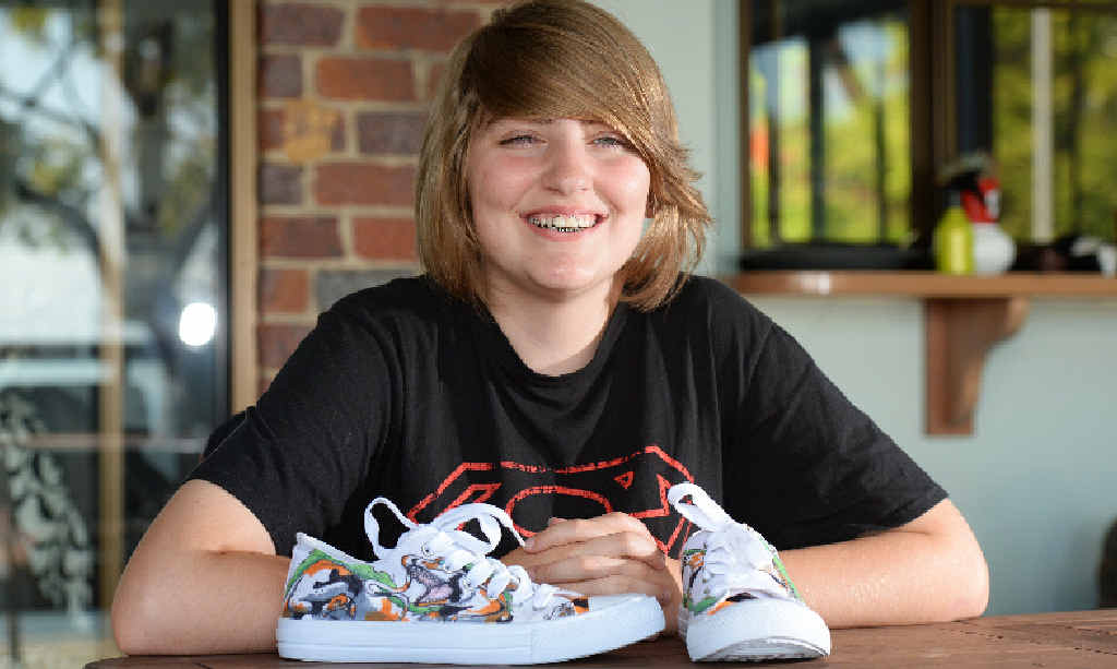 CREATIVE FLAIR: Aleyra Turnley-Dow with a pair of shoes she turned into a work of art. CREATIVE FLAIR: Aleyra Turnley-Dow with a pair of shoes she turned into a work of art.