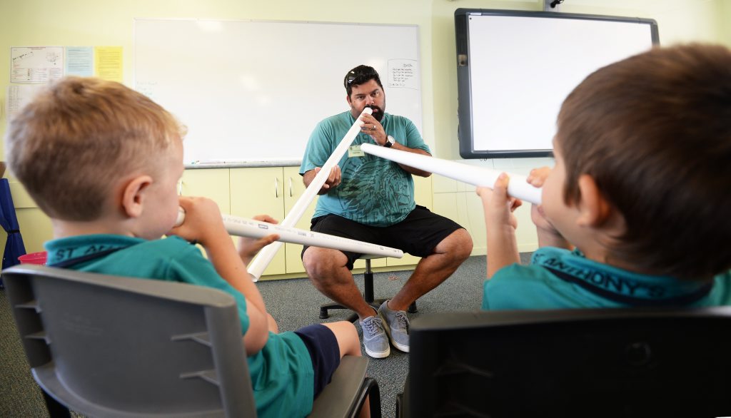 Shea Taylor teaching St Athony's students how to play digeridoo. Photo Allan Reinikka / The Morning Bulletin Shea Taylor teaching St Athony's students how to play digeridoo. Photo Allan Reinikka / The Morning Bulletin