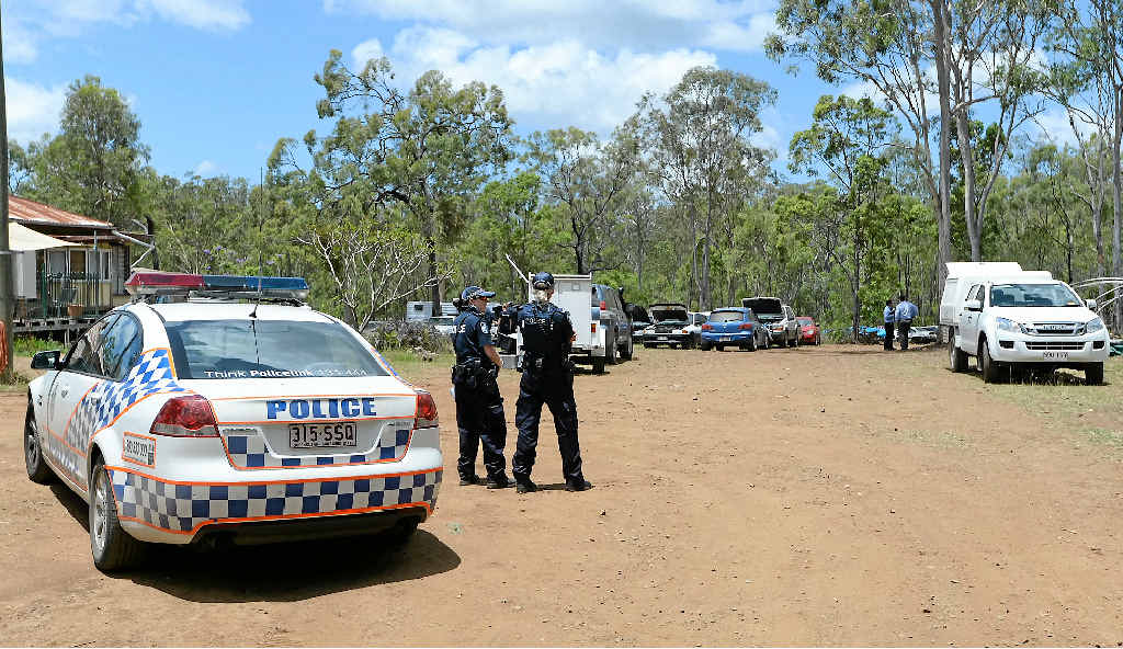 POLICE RAID: Police at the Struck Oil property where an alleged drug lab was discovered along with suspected stolen property which may include more than a dozen cars along with earth digger equipment and a motorhome. POLICE RAID: Police at the Struck Oil property where an alleged drug lab was discovered along with suspected stolen property which may include more than a dozen cars along with earth digger equipment and a motorhome.