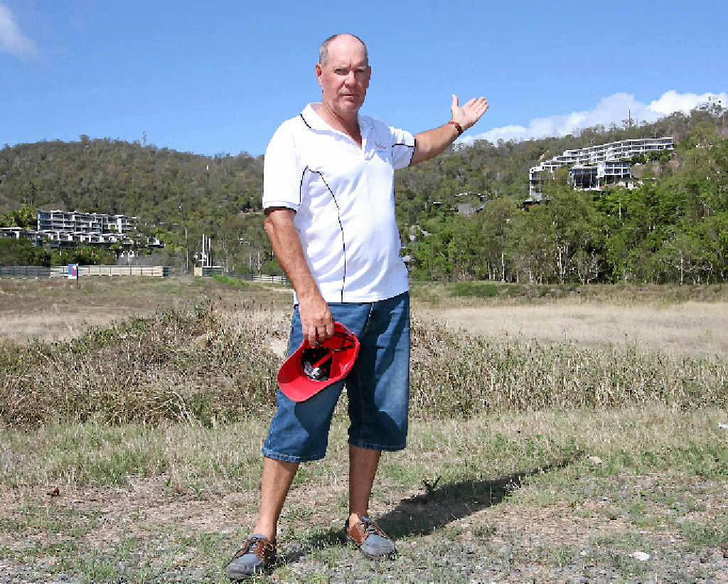 SKYLINE: Kevin Collins, on the Chinatown block, where he says an eight-storey building would hardly be taller than the highest gum tree on the site. In the background are Serene Apartments, which Mr Collins estimates at at least 15 storeys above sea level. SKYLINE: Kevin Collins, on the Chinatown block, where he says an eight-storey building would hardly be taller than the highest gum tree on the site. In the background are Serene Apartments, which Mr Collins estimates at at least 15 storeys above sea level.