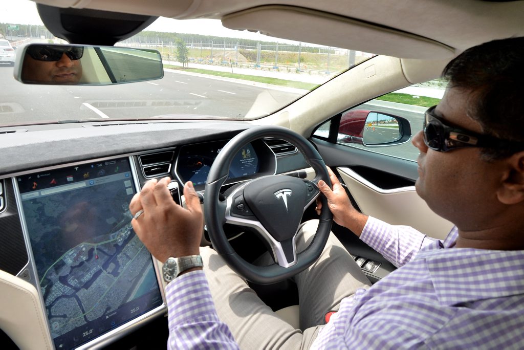 Tesla owner Vas Srinivasan has just installed new software upgrade to his Tesla that allows him to drive virtually hands free. Photo Patrick Woods / Sunshine Coast Daily Tesla owner Vas Srinivasan has just installed new software upgrade to his Tesla that allows him to drive virtually hands free. Photo Patrick Woods / Sunshine Coast Daily