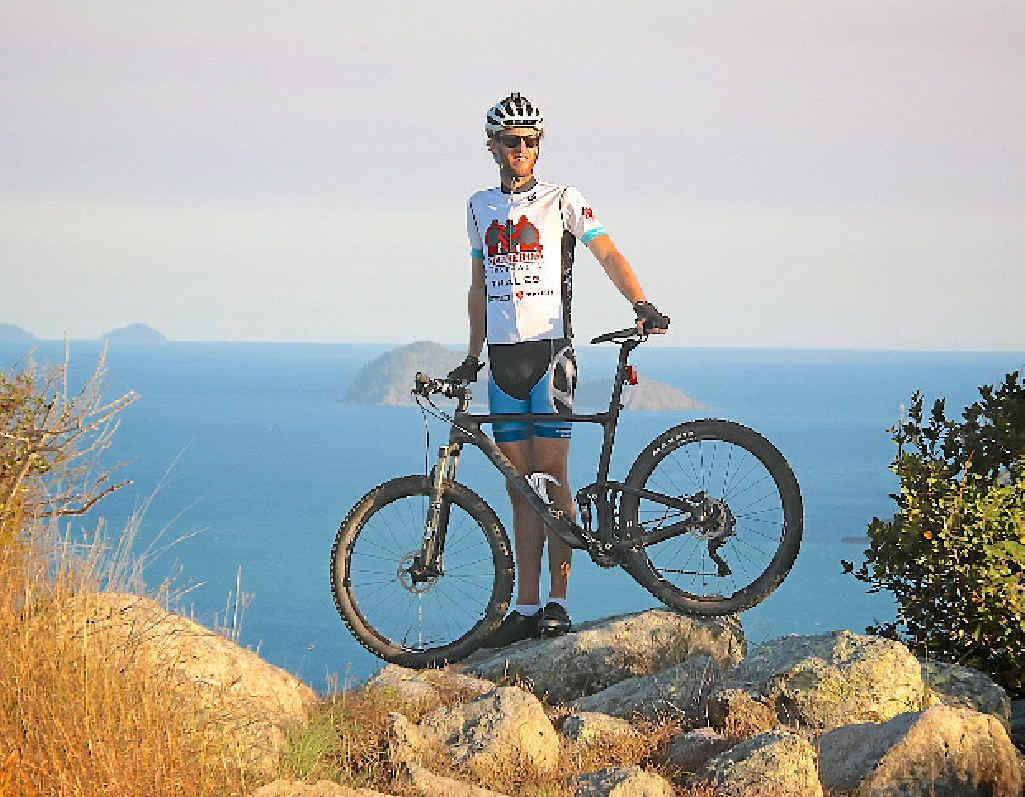 HARD YARDS: Airlie Beach helicopter pilot Ash Hogan will ride up the equivalent of Mount Everest for charity. HARD YARDS: Airlie Beach helicopter pilot Ash Hogan will ride up the equivalent of Mount Everest for charity.
