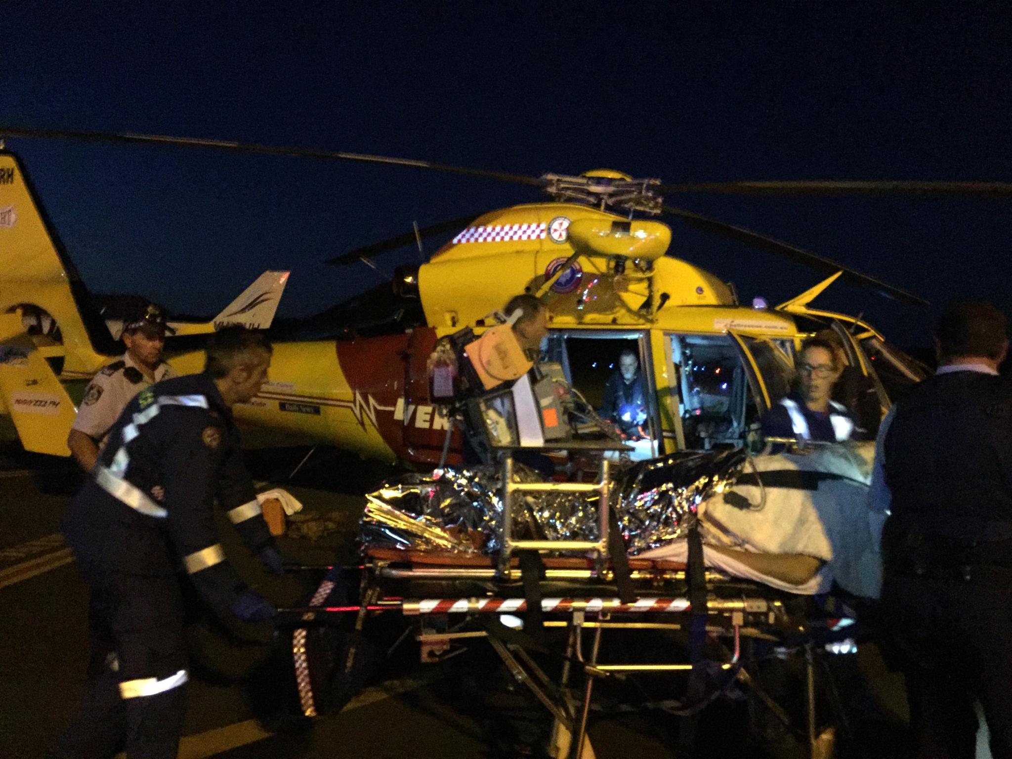 The Westpac Helicopter treating surfer Sam Morgan after he was attacked by a shark at Lighthouse Beach, Ballina, last night. The Westpac Helicopter treating surfer Sam Morgan after he was attacked by a shark at Lighthouse Beach, Ballina, last night.