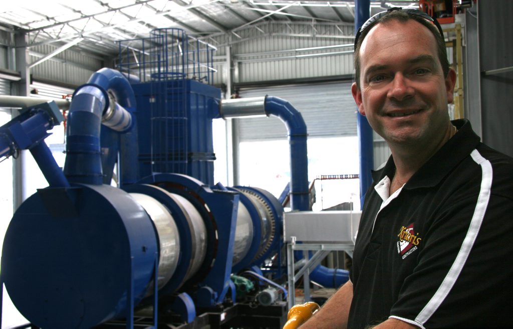 Matt Kriaris from Kriaris Recyclables and Packaging standing with the Glass Beneficiation Plant Matt Kriaris from Kriaris Recyclables and Packaging standing with the Glass Beneficiation Plant
