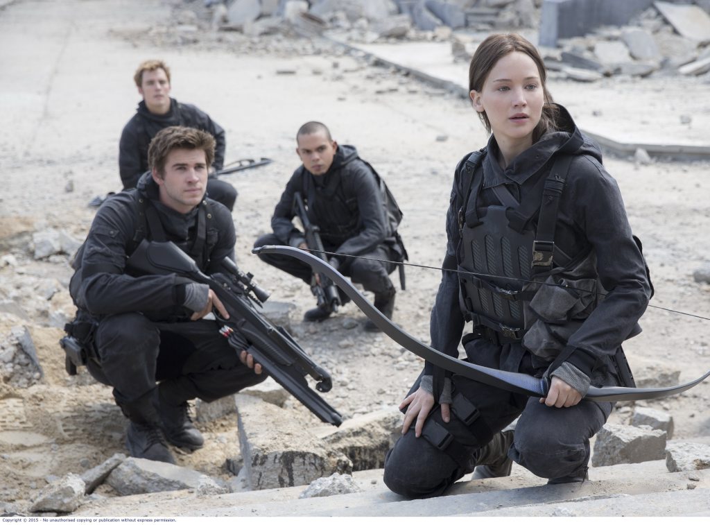 Sam Claflin, Liam Hemsworth and Jennifer Lawrence in a scene from the movie The Hunger Games: Mockingjay - Part 2. Sam Claflin, Liam Hemsworth and Jennifer Lawrence in a scene from the movie The Hunger Games: Mockingjay - Part 2.