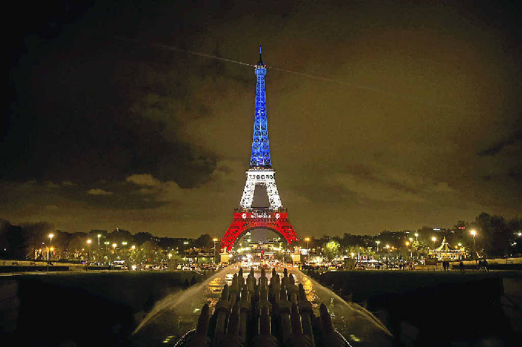 TOUCHING TRIBUTE: The Eiffel Tower is illuminated in the colours of the French flag in tribute to the victims of the terror attacks in Paris. TOUCHING TRIBUTE: The Eiffel Tower is illuminated in the colours of the French flag in tribute to the victims of the terror attacks in Paris.