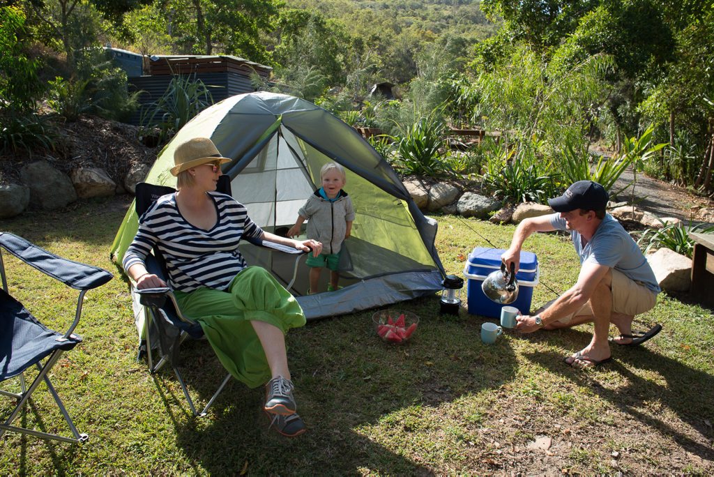 Campers Candy, young Charlie and Steve from the Darling Downs, QLD relax at their campsite on Keswick Island. Campers Candy, young Charlie and Steve from the Darling Downs, QLD relax at their campsite on Keswick Island.