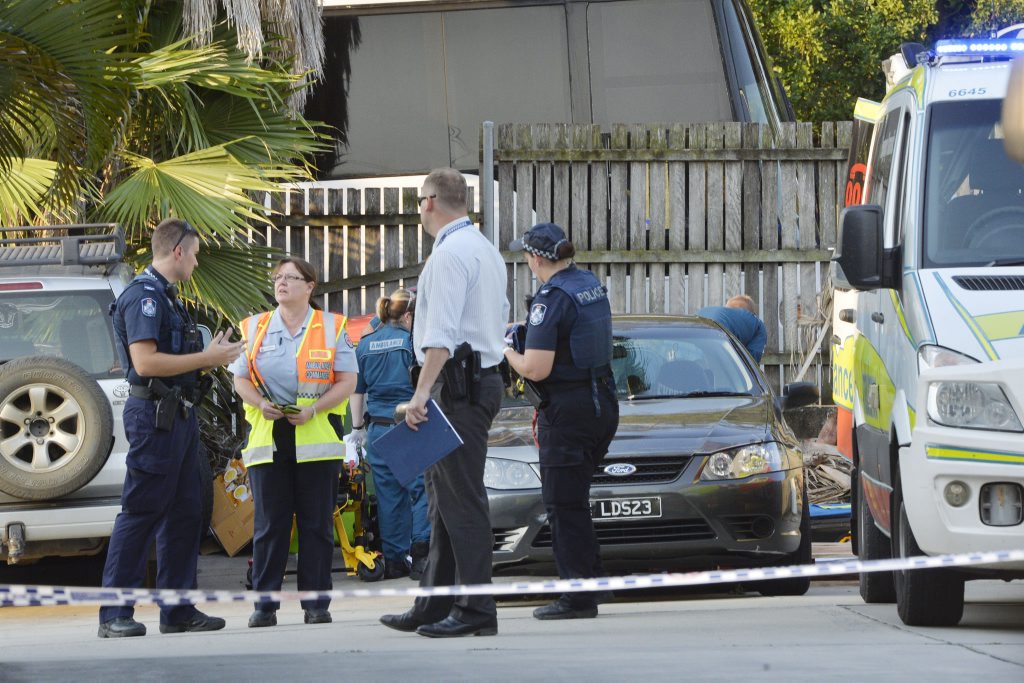 TRAGEDY: Paramedics and police desperately try to resuscitate the woman at the scene at East Ipswich. TRAGEDY: Paramedics and police desperately try to resuscitate the woman at the scene at East Ipswich.