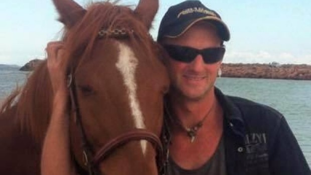 Tom with Coug, the horse he tried to save. Tom with Coug, the horse he tried to save.