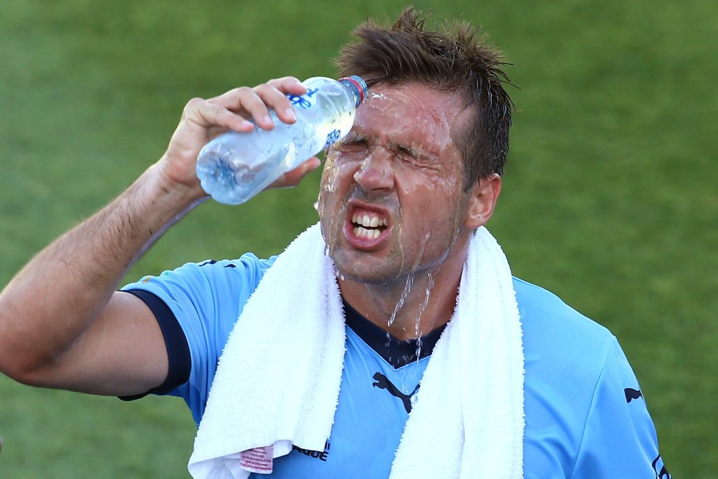 Milos Dimitrijevic, of Sydney FC, cools down as a drinks break is taken during the round seven A-League match at nib Stadium. Photo: Paul Kane/Getty Images. Milos Dimitrijevic, of Sydney FC, cools down as a drinks break is taken during the round seven A-League match at nib Stadium. Photo: Paul Kane/Getty Images.