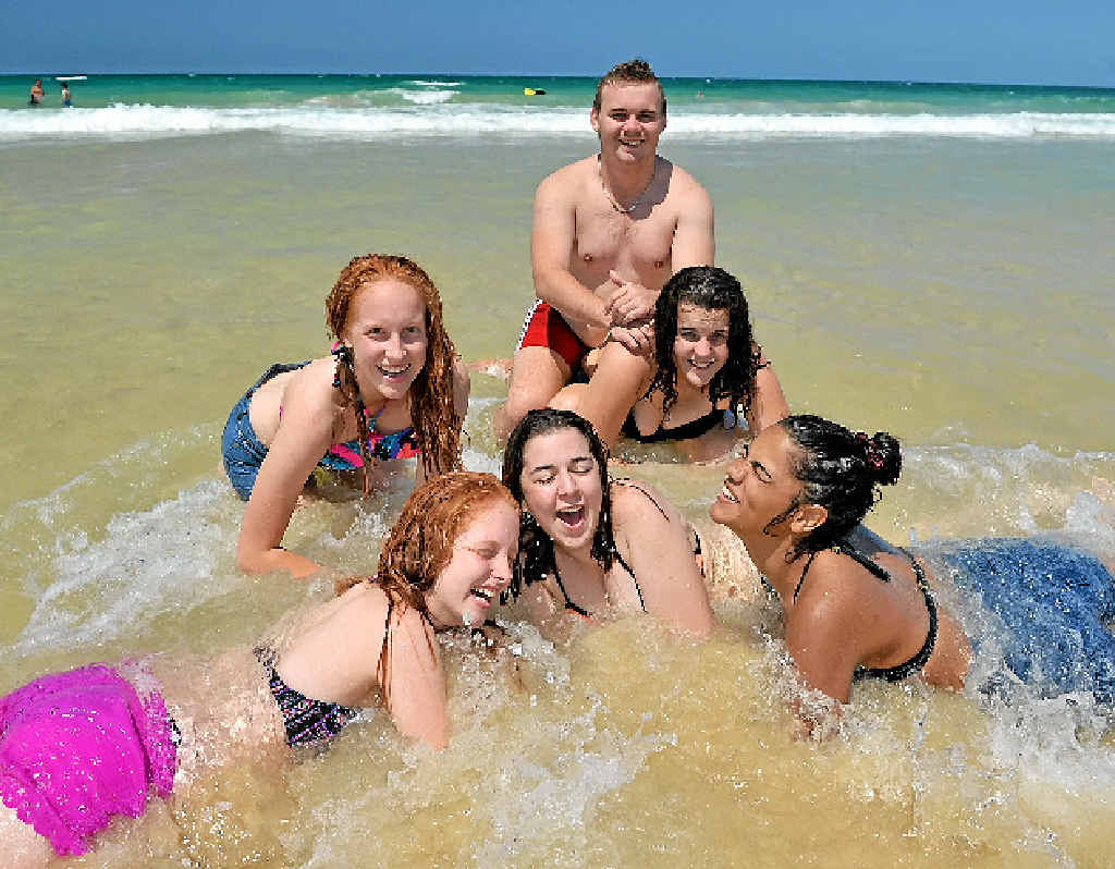 SCHOOLIES CHILL OUT: Taylib Lampton, Marnie Chapple, Joshua Salisbury, Mason Bulgarelli, Georgia Bulgarelli and Maddy Lydeamove-Walker cool off in the pristine waters of Rainbow Beach yesterday. SCHOOLIES CHILL OUT: Taylib Lampton, Marnie Chapple, Joshua Salisbury, Mason Bulgarelli, Georgia Bulgarelli and Maddy Lydeamove-Walker cool off in the pristine waters of Rainbow Beach yesterday.