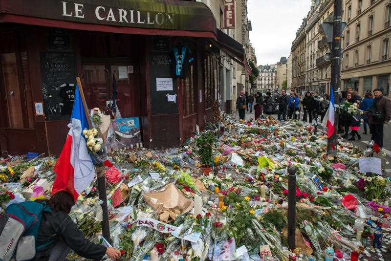 Flowers in tribute to November 13 attacks victims are seen at the foot of Le Carillon bar, in Paris, on November 21, 2015, eight days after the terror attacks which hit Paris and Saint-Denis. Flowers in tribute to November 13 attacks victims are seen at the foot of Le Carillon bar, in Paris, on November 21, 2015, eight days after the terror attacks which hit Paris and Saint-Denis.