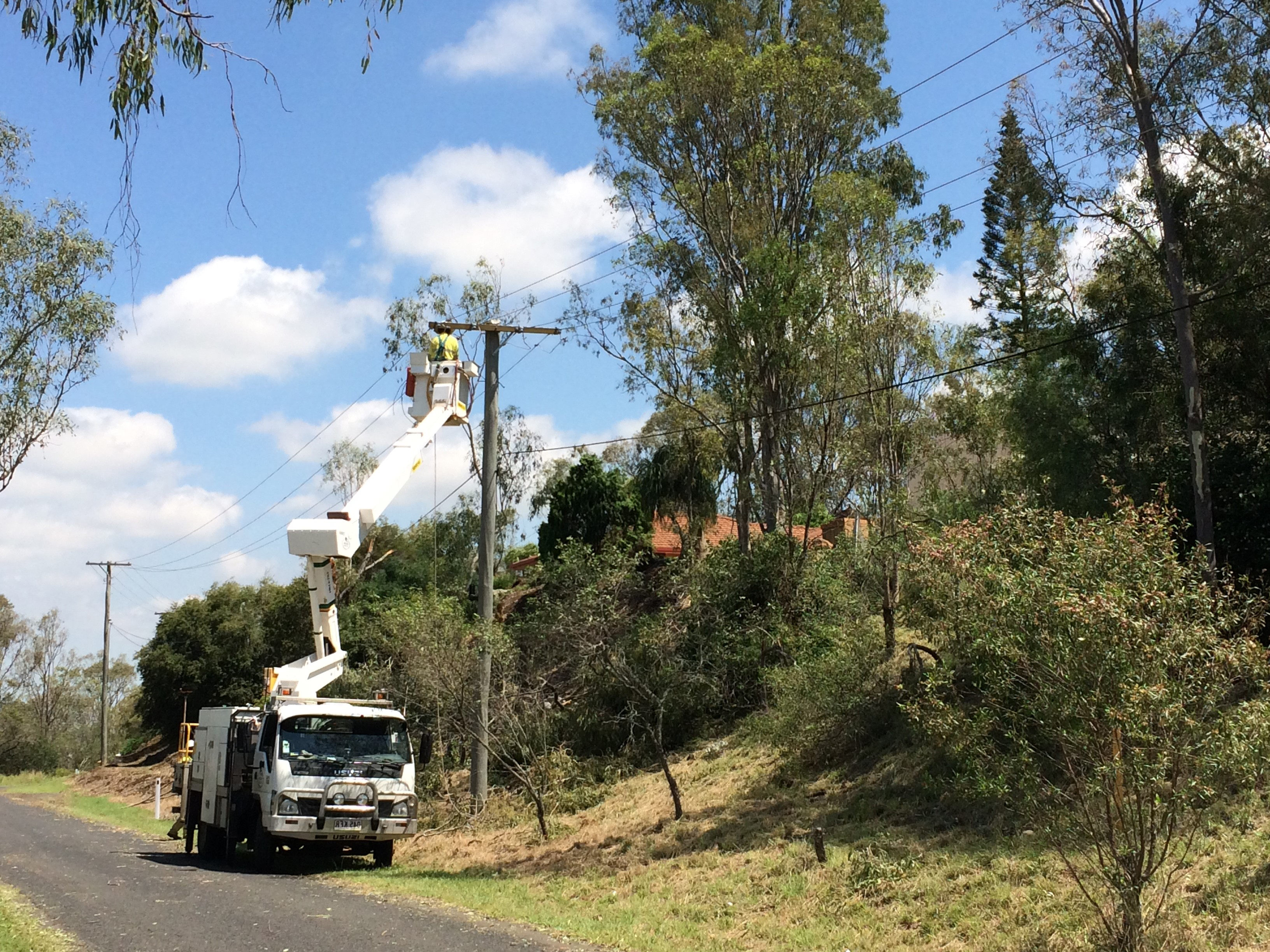 Ergon Energy crews working to restore power. Ergon Energy crews working to restore power.
