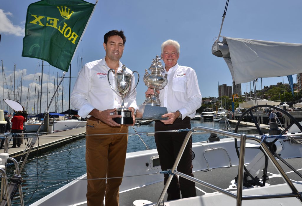 Reigning Sydney to Hobart yacht race champion Roger Hickman (R) holds the overall winners trophy, the Tattersall's Cup, aboard his 30 year-old Farr 43 Wild Rose, with Mark Richards (L) skipper of Wild Oats XI which took line honours in last year's race. Reigning Sydney to Hobart yacht race champion Roger Hickman (R) holds the overall winners trophy, the Tattersall's Cup, aboard his 30 year-old Farr 43 Wild Rose, with Mark Richards (L) skipper of Wild Oats XI which took line honours in last year's race.