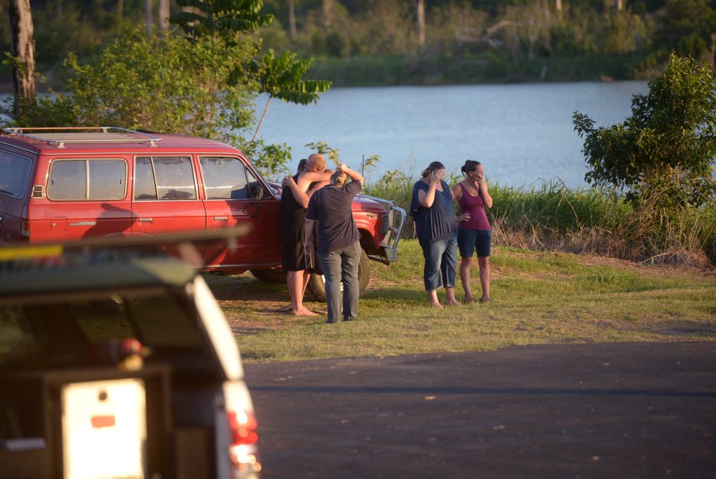 RIVER DEATH: Family members try to come to grips with the tragic scene unfolding before their eyes as a 38-year-old relative died in front of them when she was struck by a jet ski on the Burnett River yesterday. Photo: Max Fleet / NewsMail RIVER DEATH: Family members try to come to grips with the tragic scene unfolding before their eyes as a 38-year-old relative died in front of them when she was struck by a jet ski on the Burnett River yesterday. Photo: Max Fleet / NewsMail