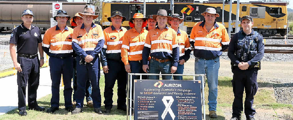 UNITED STAND: White Ribbon Day supporters Constable Dale Cook (Gracemere Police), recruit Marcus Witt, Aurizon regional general manager Peter Cowan and Aurizon staff photographed at the Stanwell Aurizon Depot for Domestic Violence Awareness Month. UNITED STAND: White Ribbon Day supporters Constable Dale Cook (Gracemere Police), recruit Marcus Witt, Aurizon regional general manager Peter Cowan and Aurizon staff photographed at the Stanwell Aurizon Depot for Domestic Violence Awareness Month.