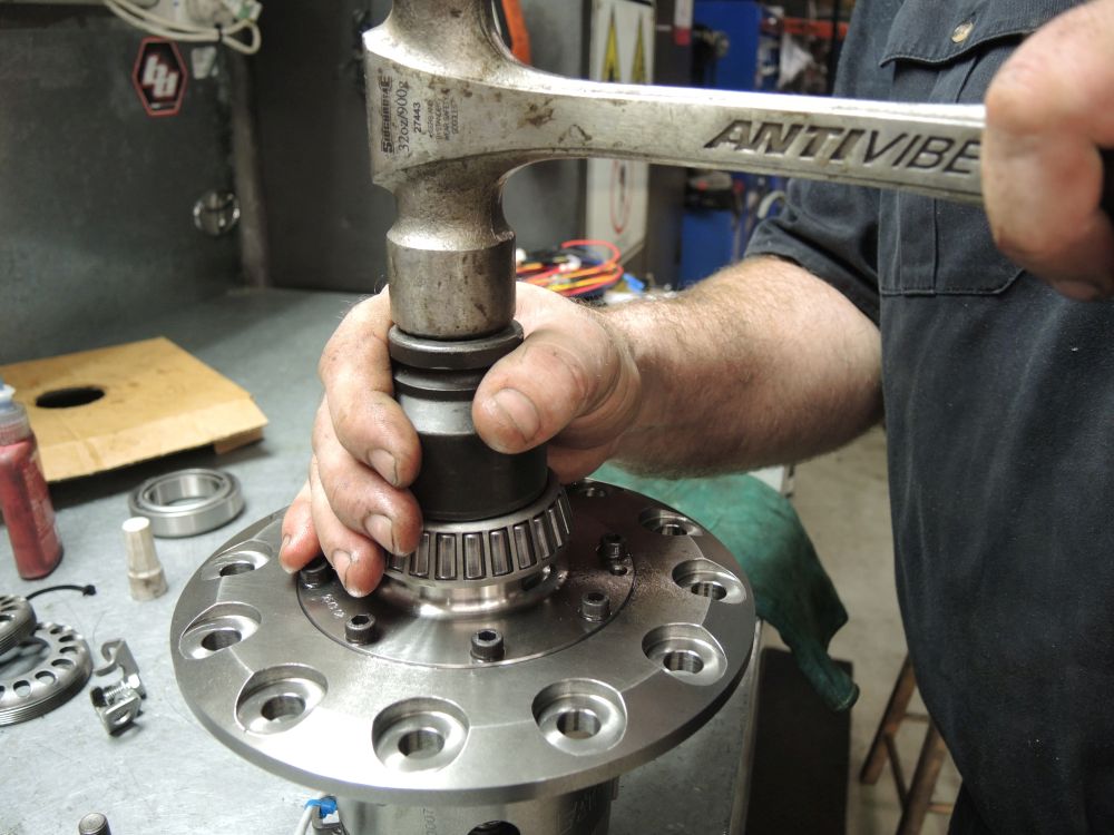 The new bearings need a precise fitment, that's a highly calibrated hammer he's working with The new bearings need a precise fitment, that's a highly calibrated hammer he's working with