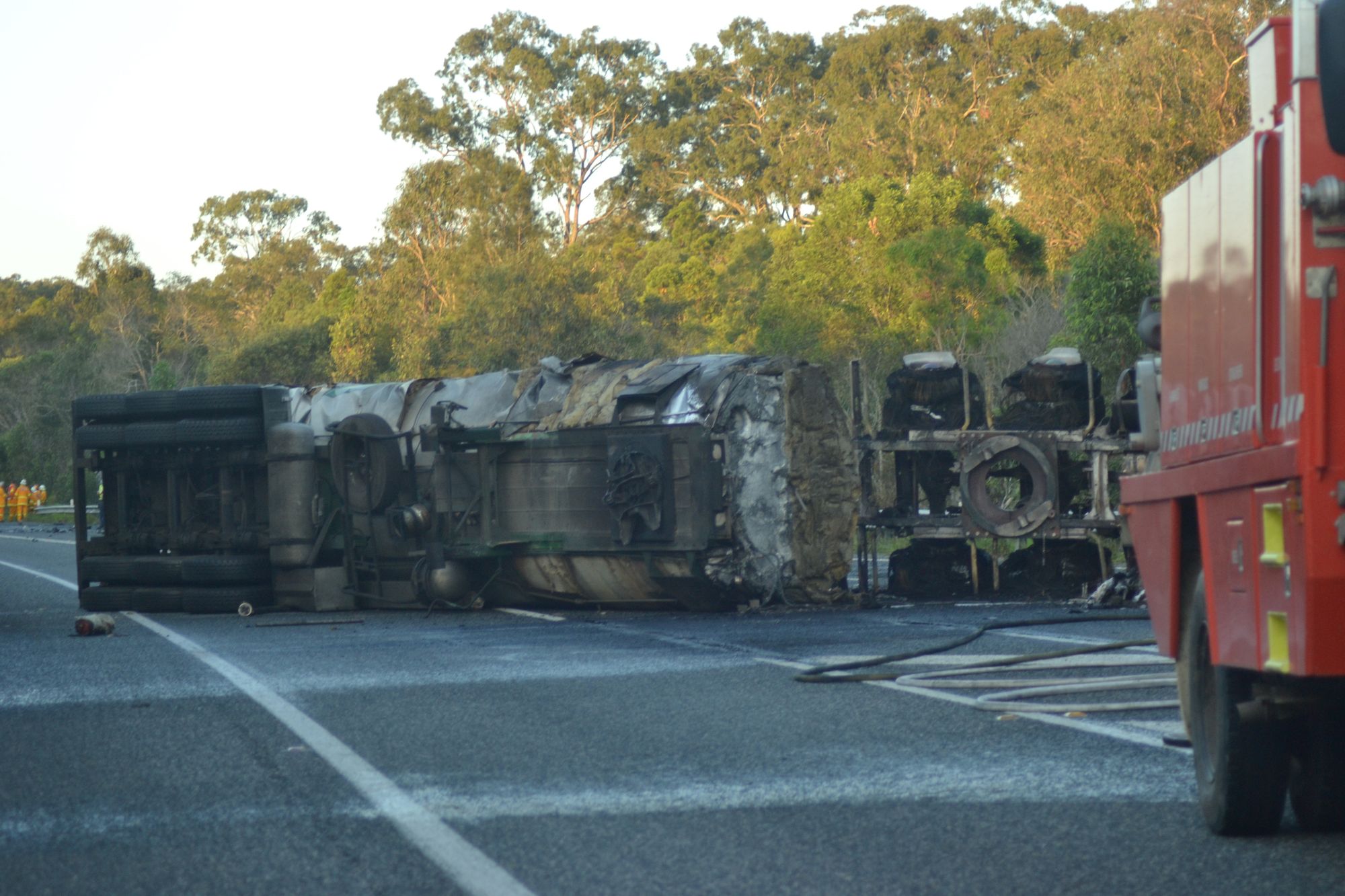 HEAD ON: A collision between a petrol tanker and sedan saw one person killed and the Pacific Highway, just south of Woodburn closed. HEAD ON: A collision between a petrol tanker and sedan saw one person killed and the Pacific Highway, just south of Woodburn closed.