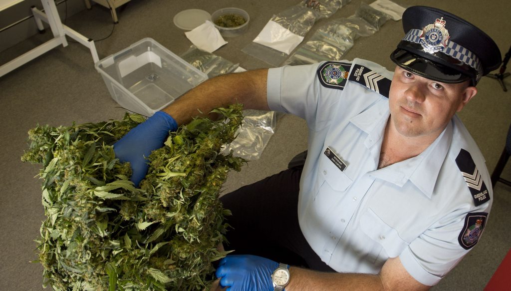 Sergeant Dan Curtin with a drug haul at Toowoomba Police Station. Sergeant Dan Curtin with a drug haul at Toowoomba Police Station.