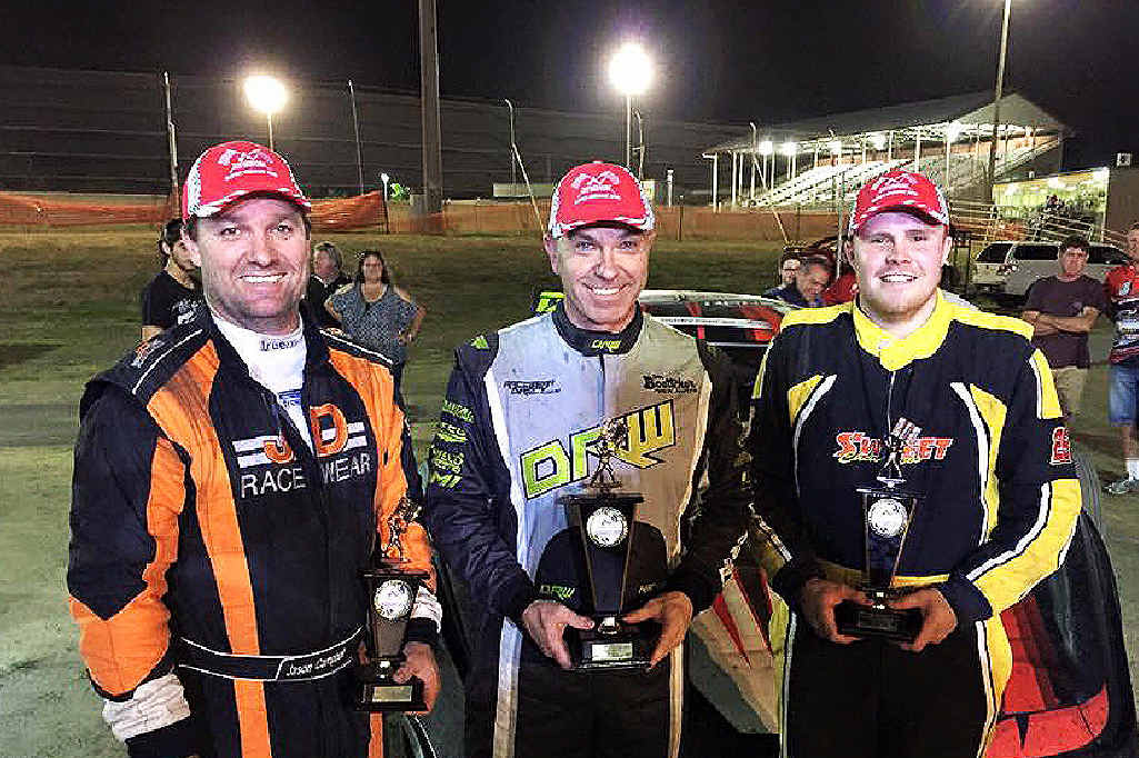 CENTRE OF SUCCESS: Ipswich racer Darren Kane (middle) savours his Queensland Super Sedan Series round victory in Rockhampton. He’s flanked by second placegetter Sean Black (right) and third placegetter Jason Campbell. CENTRE OF SUCCESS: Ipswich racer Darren Kane (middle) savours his Queensland Super Sedan Series round victory in Rockhampton. He’s flanked by second placegetter Sean Black (right) and third placegetter Jason Campbell.