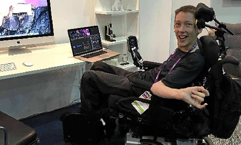 FORGING AHEAD: Brisbane’s Christopher Hills, who lives with cerebral palsy and quadriplegia, edits a video with the help of technology wired to the back of his wheelchair headrest. FORGING AHEAD: Brisbane’s Christopher Hills, who lives with cerebral palsy and quadriplegia, edits a video with the help of technology wired to the back of his wheelchair headrest.