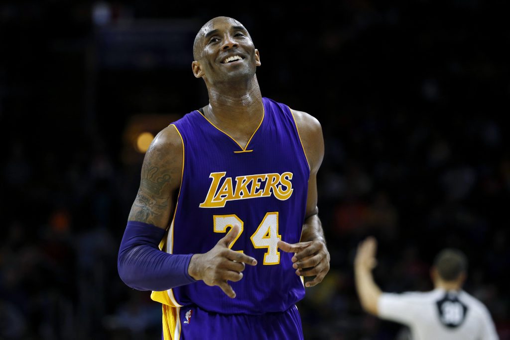 Los Angeles Lakers' Kobe Bryant smiles as he jogs to the bench during the first half of an NBA basketball game against the Philadelphia 76ers. Photo: AP Photo/Matt Slocum. Los Angeles Lakers' Kobe Bryant smiles as he jogs to the bench during the first half of an NBA basketball game against the Philadelphia 76ers. Photo: AP Photo/Matt Slocum.
