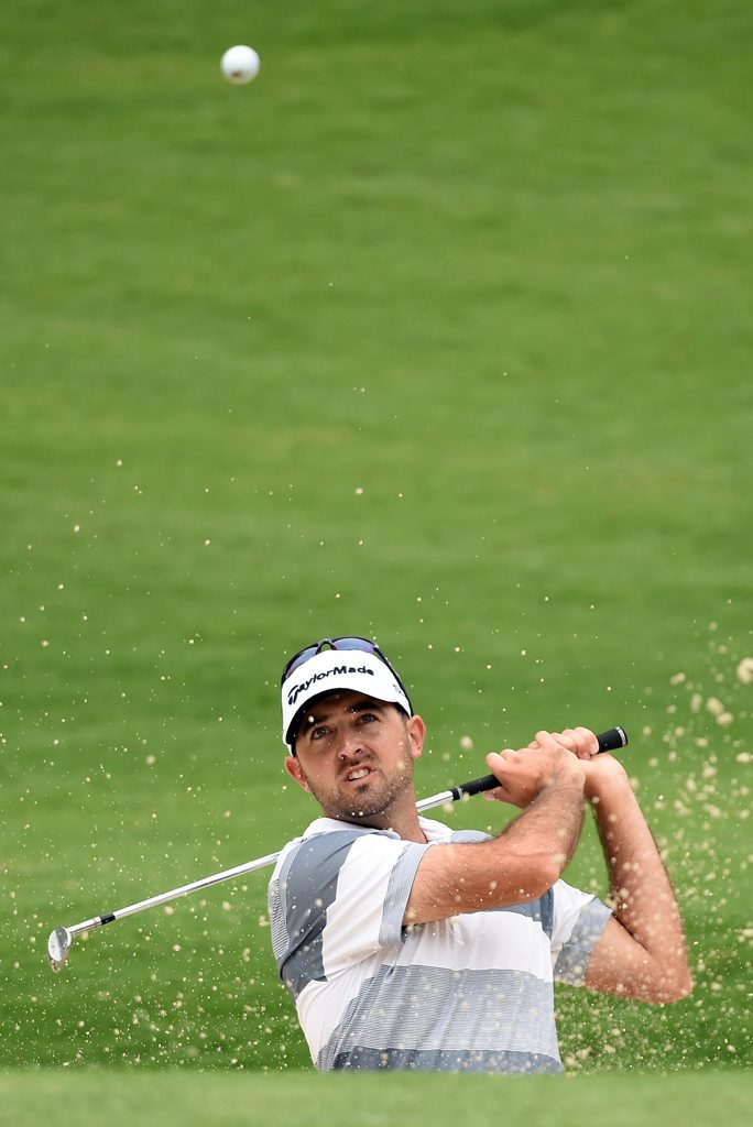 Australia's Rhein Gibson chips out of a bunker on the 2nd hole during round 1 for the Australian Open Golf Championship at The Australian Golf Club in Sydney on Thursday, Nov. 27, 2014. (AAP Image/Paul Miller) NO ARCHIVING Australia's Rhein Gibson chips out of a bunker on the 2nd hole during round 1 for the Australian Open Golf Championship at The Australian Golf Club in Sydney on Thursday, Nov. 27, 2014. (AAP Image/Paul Miller) NO ARCHIVING