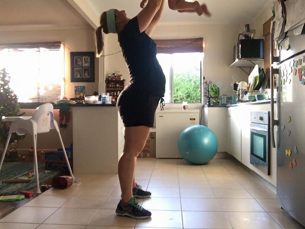 FUN ON THE RUN: Eliza Carige holds up her 18-month-old son for some healthy morning exerise before beginning her work from home. Photo Contributed FUN ON THE RUN: Eliza Carige holds up her 18-month-old son for some healthy morning exerise before beginning her work from home. Photo Contributed