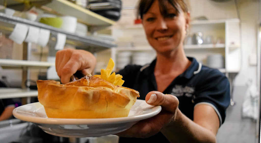 MEAT KAREN: Co-owner Karen Guthrie shows off what the pub is all about, with a home made pie. MEAT KAREN: Co-owner Karen Guthrie shows off what the pub is all about, with a home made pie.