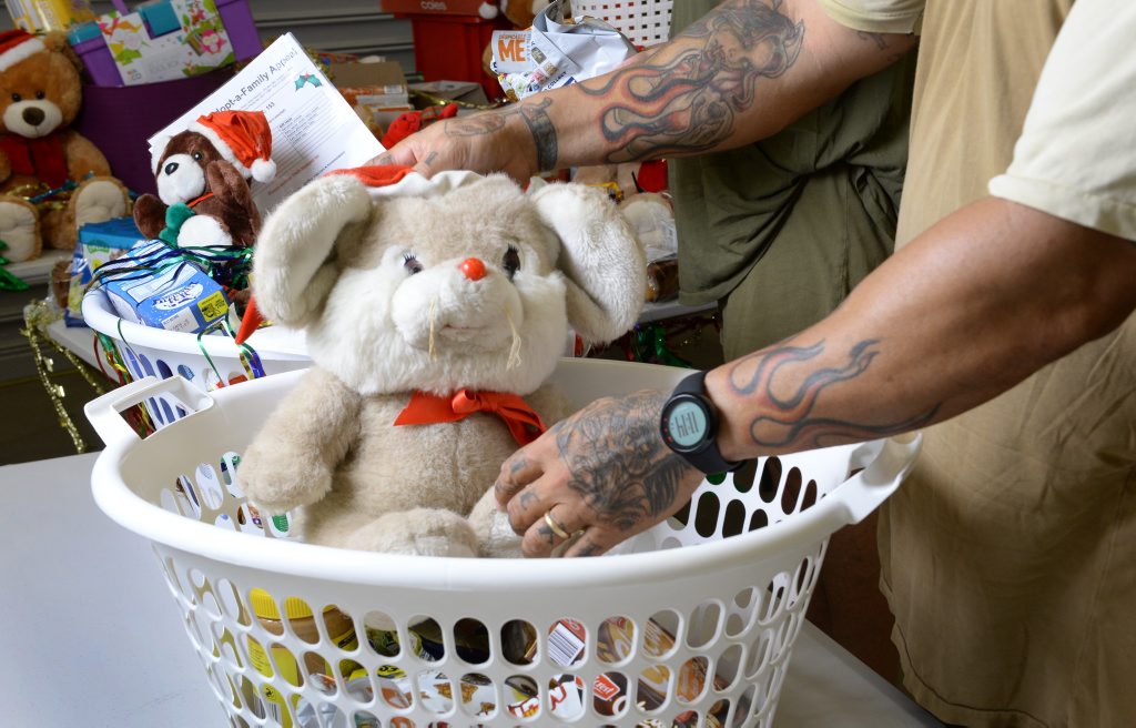 Prisoners John and Kevin from the Southern Queensland Correctional Centre help stock baskets full of goodies as part of the QT Adopt a Family Appeal. Prisoners John and Kevin from the Southern Queensland Correctional Centre help stock baskets full of goodies as part of the QT Adopt a Family Appeal.