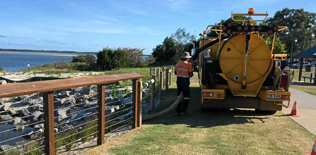 PUMP ACTION: Workers drain the Infiltration Basin after yesterday’s sewage spill. PUMP ACTION: Workers drain the Infiltration Basin after yesterday’s sewage spill.