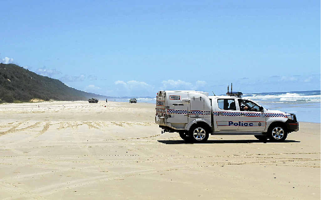 NO ENTRY: Police block off Teewah Beach yesterday after a suspicious device was found, later identified as a marine marker. NO ENTRY: Police block off Teewah Beach yesterday after a suspicious device was found, later identified as a marine marker.