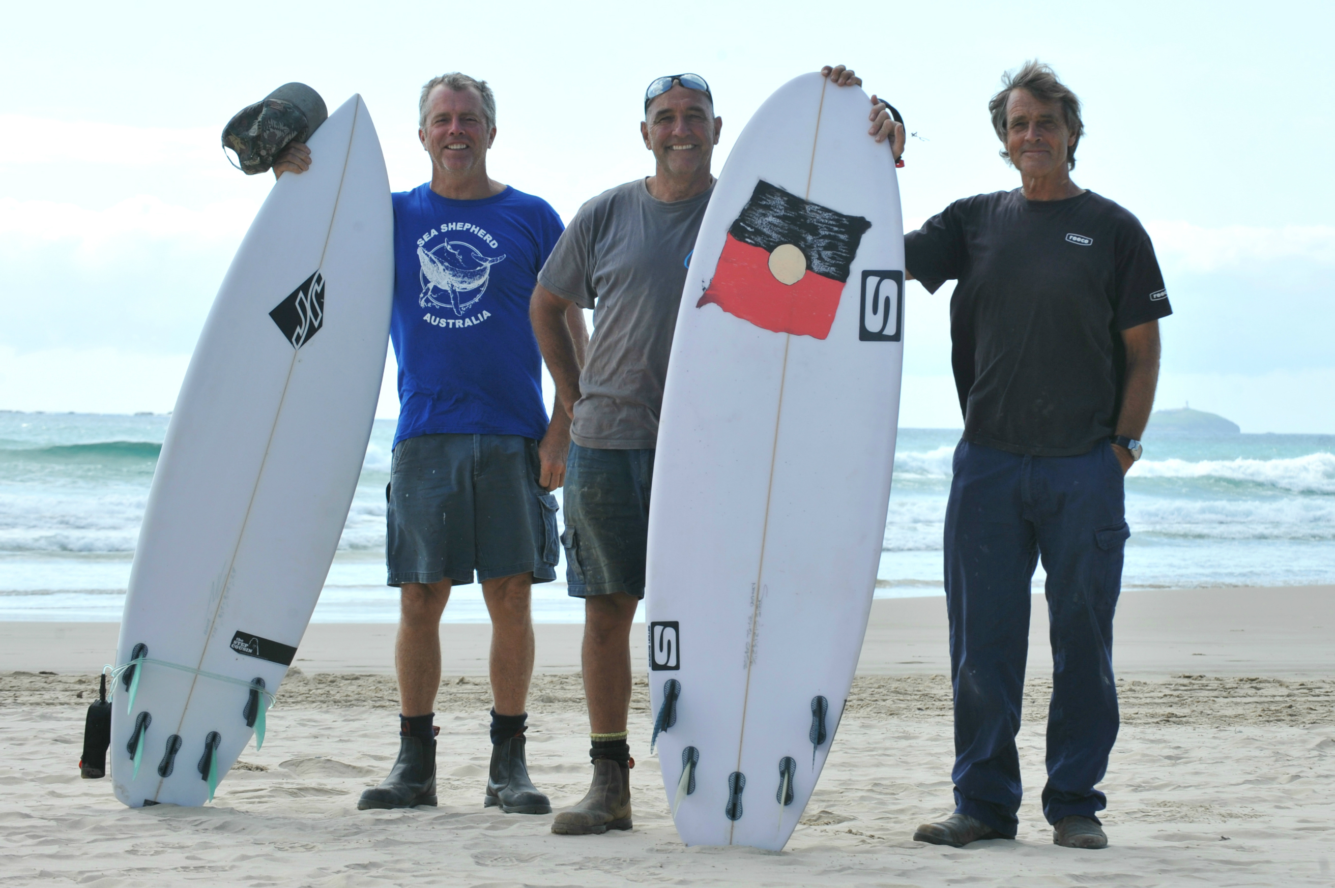 RELIEVED MATES: Peter Knox, Geoff Williams and Paul Thomas were surfing at Sandy Beach at the weekend when Geoff fended off a two-metre shark. RELIEVED MATES: Peter Knox, Geoff Williams and Paul Thomas were surfing at Sandy Beach at the weekend when Geoff fended off a two-metre shark.