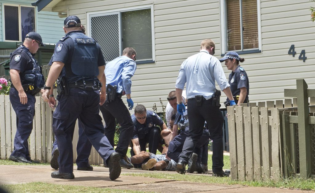 Police arrest a man accused of trying to run down an officer in a stolen car in Harlaxton, Toowoomba, this morning. Police arrest a man accused of trying to run down an officer in a stolen car in Harlaxton, Toowoomba, this morning.