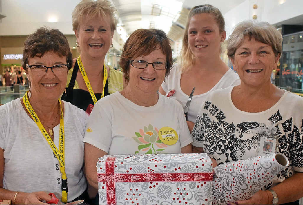 CareFlight volunteer Julie Dever (right) with other dedicated helpers at the gift wrap stall at Robina Town Centre. CareFlight volunteer Julie Dever (right) with other dedicated helpers at the gift wrap stall at Robina Town Centre.