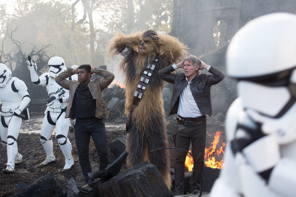 FOR REVIEW AND PREVIEW PURPOSES ONLY. John Boyega, Peter Mayhew (as Chewbacca) and Harrison Ford in a scene from the movie Star Wars: The Force Awakens. Supplied by Disney. Please credit photo to David James. FOR REVIEW AND PREVIEW PURPOSES ONLY. John Boyega, Peter Mayhew (as Chewbacca) and Harrison Ford in a scene from the movie Star Wars: The Force Awakens. Supplied by Disney. Please credit photo to David James.
