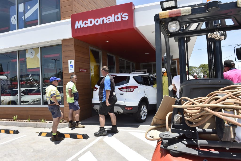 A car has crashed into a section of the new McDonald's Restaurant on Herries Street injuring two children. A car has crashed into a section of the new McDonald's Restaurant on Herries Street injuring two children.