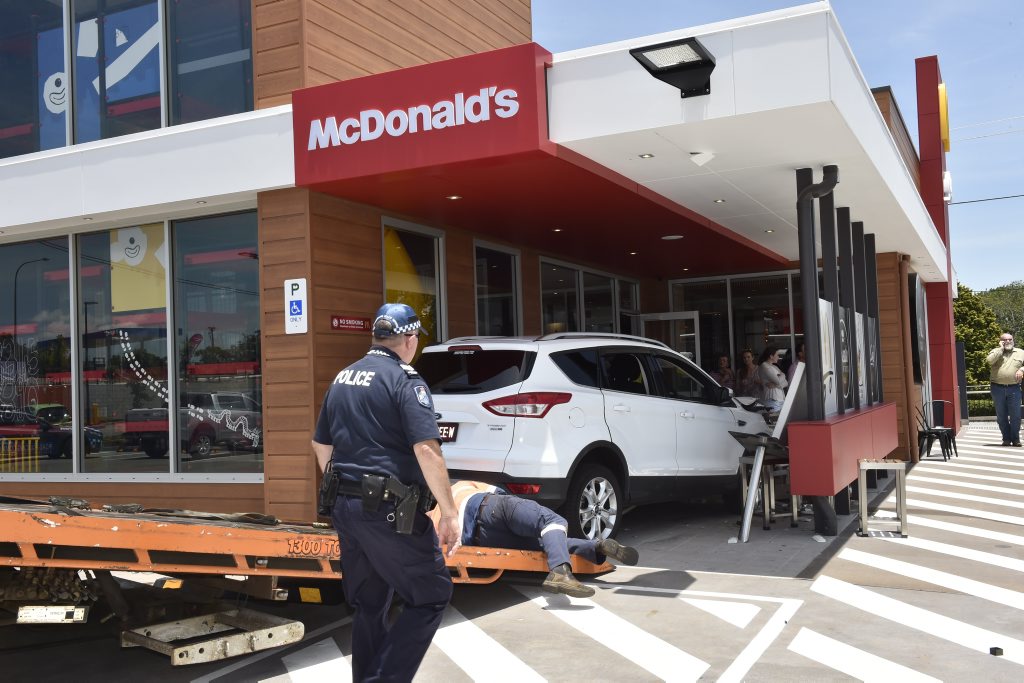 A car has crashed into a section of the new McDonald's Restaurant on Herries Street injuring two children. A car has crashed into a section of the new McDonald's Restaurant on Herries Street injuring two children.