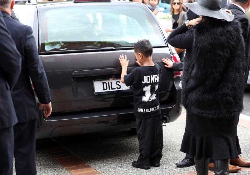 Widow of Jonah Lomu, Nadene Lomu and her two sons, Brayley Lomu (R, behind his mother) and Dhyreille Lomu (L) at the Funeral Service for Jonah Lomu at The Church of Jesus Christ of Latter-Day Saints on December 01, 2015 in Auckland, New Zealand. Ex-Rugby and All Black Player Jonah Lomu died on the 18th of November 2015 at the age of 40. Widow of Jonah Lomu, Nadene Lomu and her two sons, Brayley Lomu (R, behind his mother) and Dhyreille Lomu (L) at the Funeral Service for Jonah Lomu at The Church of Jesus Christ of Latter-Day Saints on December 01, 2015 in Auckland, New Zealand. Ex-Rugby and All Black Player Jonah Lomu died on the 18th of November 2015 at the age of 40.