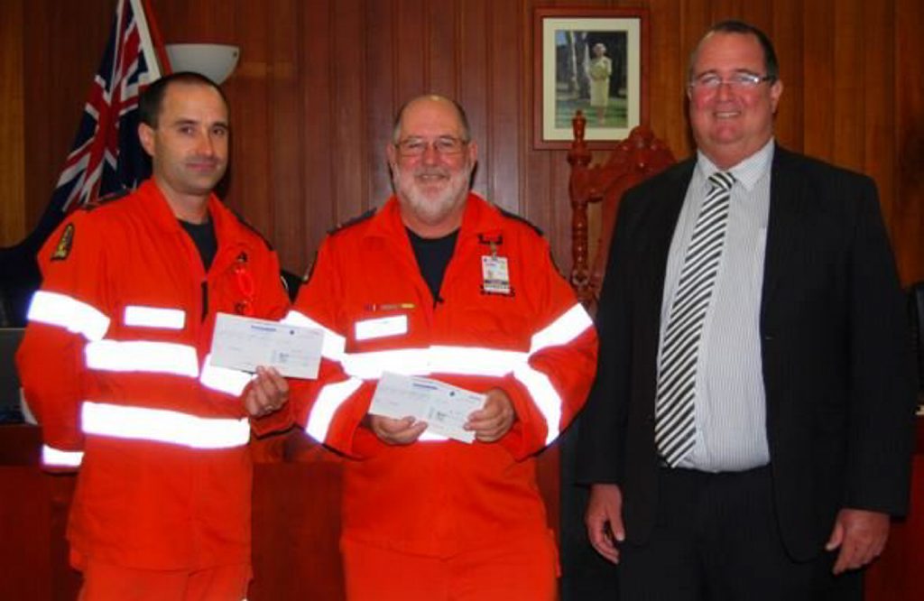 Mayor Peter Blundell presents the 'Casual for a Cause' staff donations to SES Local Controllers Michael Bell, Stanthorpe and John Newley, Warwick. Mayor Peter Blundell presents the 'Casual for a Cause' staff donations to SES Local Controllers Michael Bell, Stanthorpe and John Newley, Warwick.