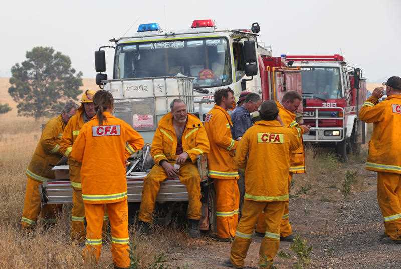 Firefighters take a break from containing a bushfire near Scotsburn, South of Ballarat in Victoria, Sunday, Dec 20. 2015. Victoria is experiencing bushfires and extreme heat. Firefighters take a break from containing a bushfire near Scotsburn, South of Ballarat in Victoria, Sunday, Dec 20. 2015. Victoria is experiencing bushfires and extreme heat.