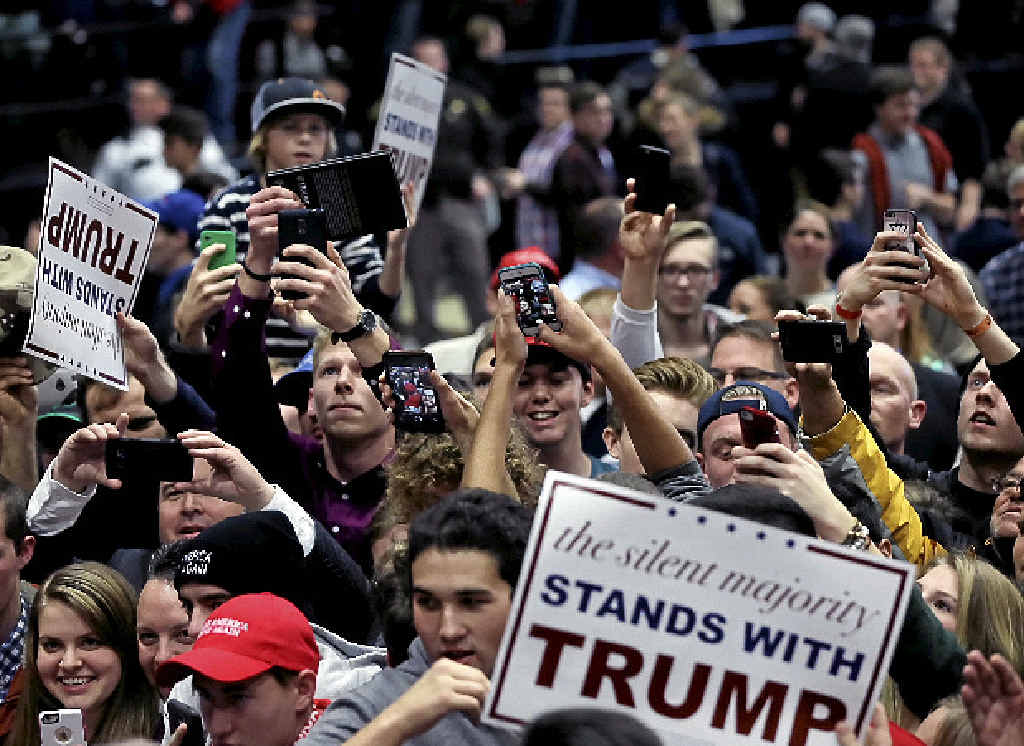 STARSTRUCK: Supporters of Donald Trump show their enthusiasm for the candidate at a campaign rally in Grand Rapids, Michigan. STARSTRUCK: Supporters of Donald Trump show their enthusiasm for the candidate at a campaign rally in Grand Rapids, Michigan.