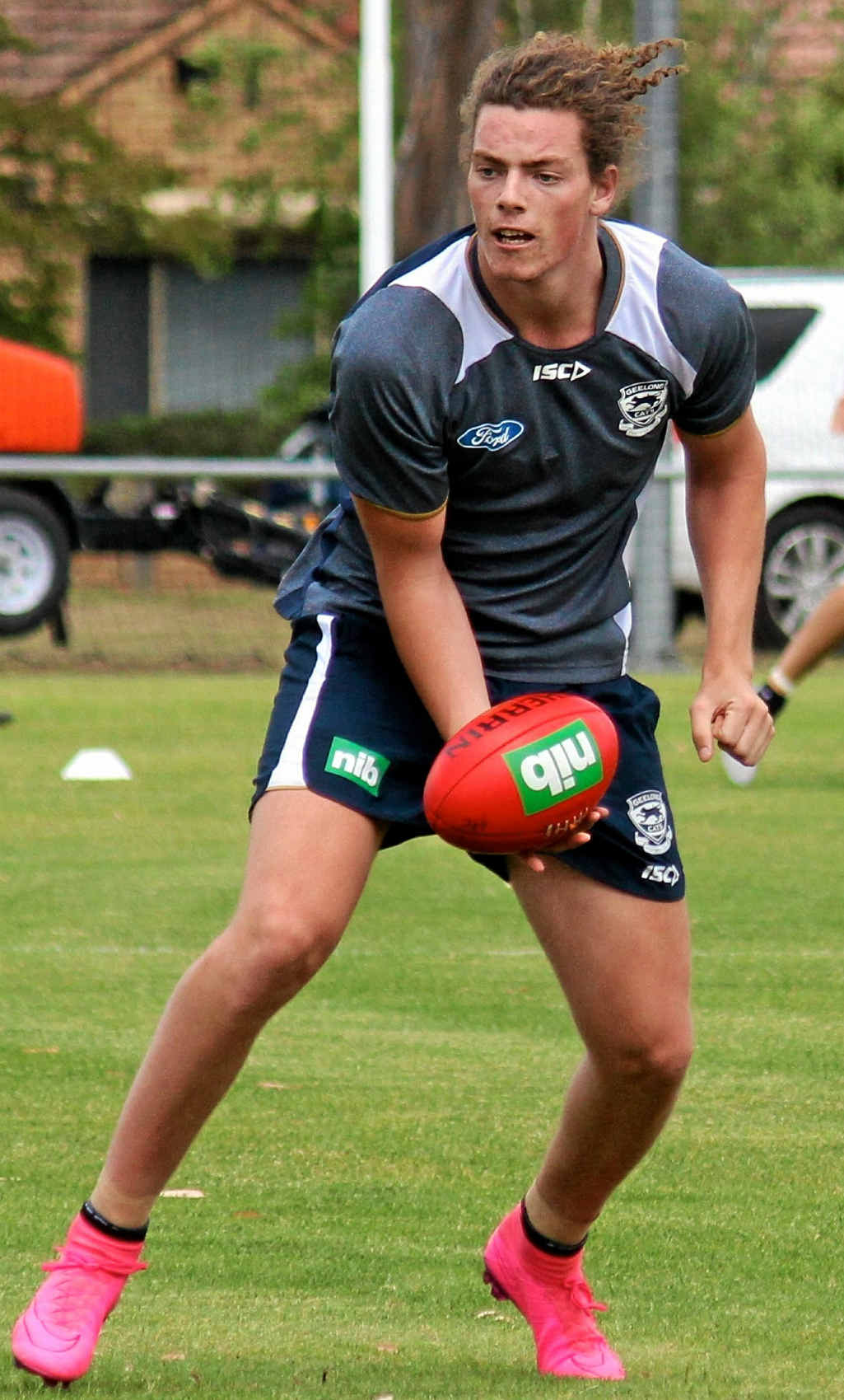 Wylie Buzza does competitive training at Simonds Stadium ... with 'those' pink boots. Photo: Geelong Cats Wylie Buzza does competitive training at Simonds Stadium ... with 'those' pink boots. Photo: Geelong Cats
